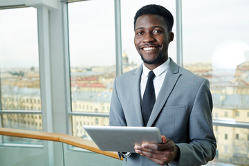 Fototapeta premium Successful banker with touchpad working online