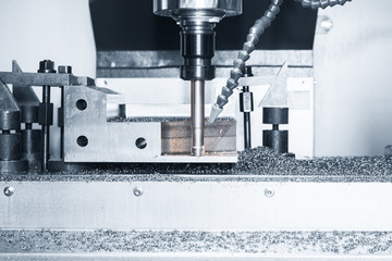 High precision CNC machining center working, operator machining automotive sample part process