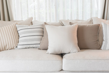 set of pillows on classic sofa in modern living room