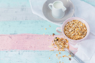 Muesli in bowl over wooden background. Healthy food