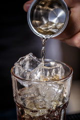 Bartender pouring alcohol