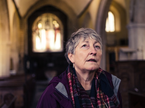 Senior woman exploring church