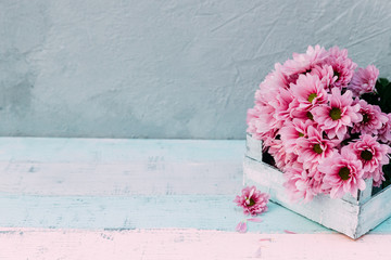 Flowers over wooden background