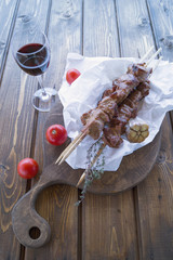 roast meat on a spit with rosemary and garlic. kebab