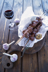 roast meat on a spit with rosemary and garlic. kebab