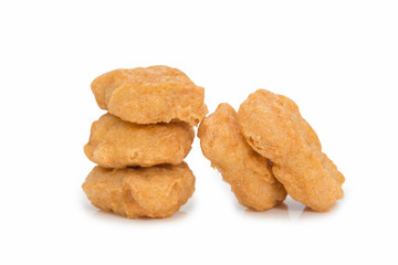 Fried chicken nuggets isolated on white background.
