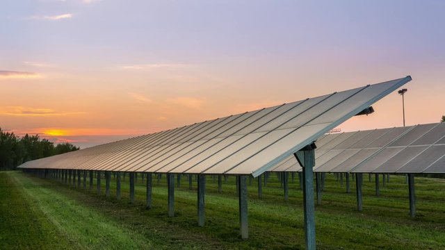 solar panels field timelapse at sunset