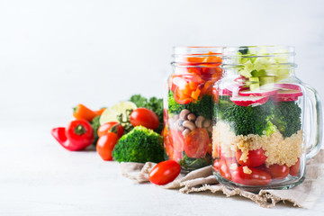Fototapeta na wymiar Healthy vegan salad in a mason jar with quinoa