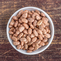 pinto beans / Porcelain bowl with quail beans