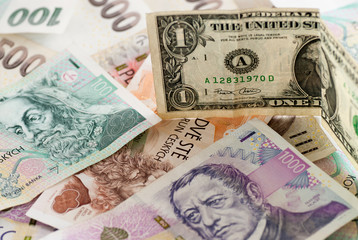Fototapeta na wymiar czech koruna currency and one dollar bill concept photo