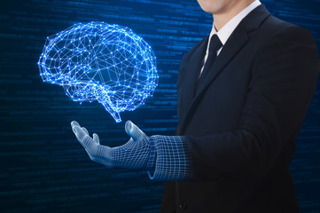 businessman with wire-frame hand holding virtual brain 