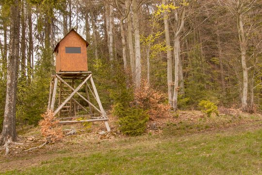 Hunting hide in the forest. Hunting stash. The wooden tower.