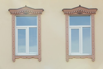 Fototapeta na wymiar Vintage windows with light wall background