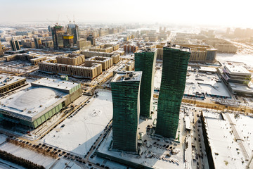 Obraz na płótnie Canvas Top view of the Northern Lights residential complex and the city in the warm sun in Astana, Kazakhstan