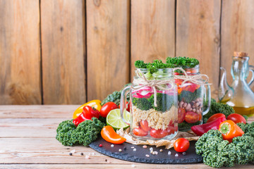 Healthy vegan salad in a mason jar with quinoa