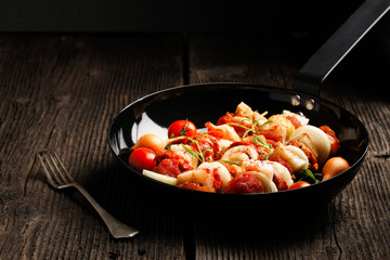 Vegetable and meat on wooden skewers on plate