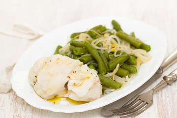 boiled fish with green beans on white dish