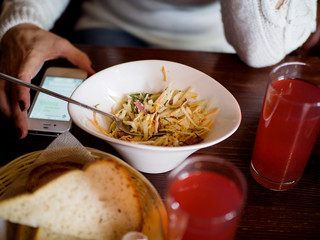 Business lunch in the cafe and mobile phone on the table
