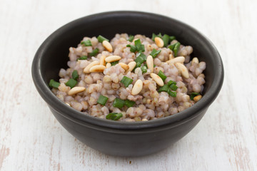 boiled buckwheat in black bowl