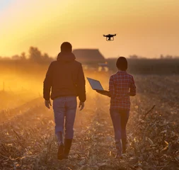 Fotobehang Farmers with drone on field © Budimir Jevtic