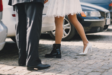 Bride and groom's legs and shoes