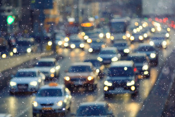 Snow in the city night traffic road transport