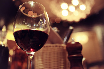 glass of red wine in restaurant interior