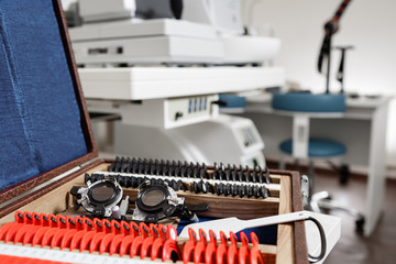 closeup of ophthalmic glasses for vision testing and set of lenses