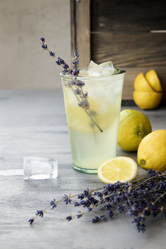 Lemonade with lemons and lavender on gray  shabby table
