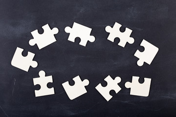Business solution concept jigsaw on the blackboard