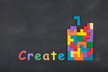 Business creative idea concept - inscription and jigsaw blocks on the blackboard