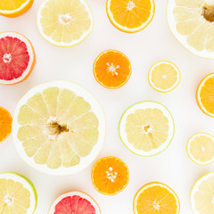 Fototapeta premium Tropical summer mix with fresh lemon, orange, mandarin, grapefruit and sweetie on white background. Flat lay, top view.
