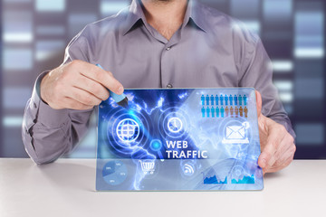 Business, Technology, Internet and network concept. Young businessman working on a virtual screen of the future and sees the inscription: Web traffic