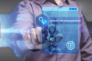 Business, Technology, Internet and network concept. Young businessman working on a virtual screen of the future and sees the inscription: Inventory management