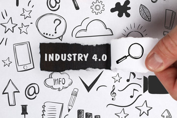 Business, Technology, Internet and network concept. Young businessman shows the word: Industry 4.0