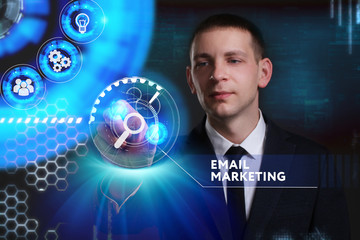 Business, Technology, Internet and network concept. Young businessman working on a virtual screen of the future and sees the inscription: Email marketing
