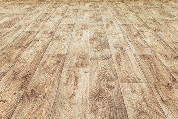 Linoleum flooring with embossed wood texture. Brown floor large area. Horizontal layout perspective.