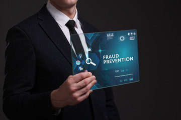Business, Technology, Internet and network concept. Young businessman working on a virtual screen of the future and sees the inscription: Fraud prevention