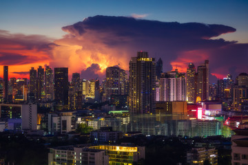 Fototapeta na wymiar Thunderstorm over Bangkok in Thailand during a colorful sunset . . 