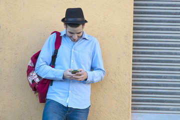 young man with mobile in the city