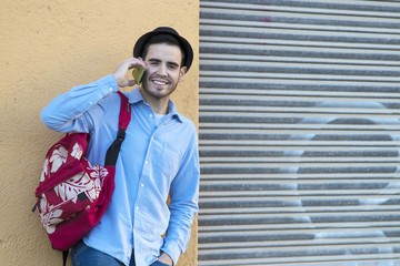 young man with mobile in the city