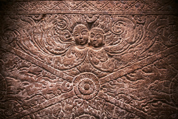 Magic two ghost on carved wall relief inside the 6th century temples in Aihole, India. Ancient Indian artwork.