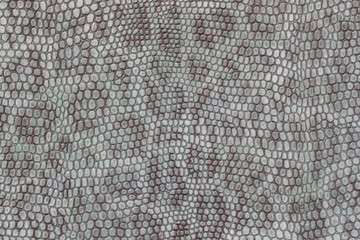Genuine leather texture background close-up, embossed under the skin a beautiful imitation of leopard, blue color print, fashion trend jungle background