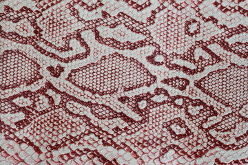 Texture of genuine leather close-up, embossed under the skin a reptile, with fashion pattern and...