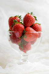 Strawberries in vase. Large strawberries are red and delicious. Berry for diet rich in vitamins.
