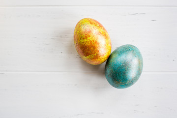 Easter eggs on white wooden background