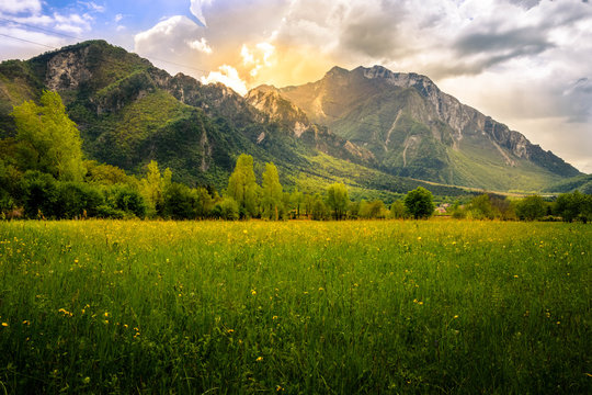 Spring landscape from meadows in Venzone, Italy, with beautiful mountains in the background.
