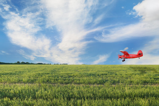Red airplane biplane with piston engine