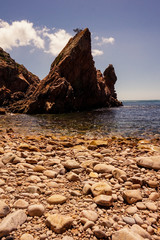 Fototapeta premium Amazing Wild rock beach at the sunset. Sintra Cascais Natural Park Portugal