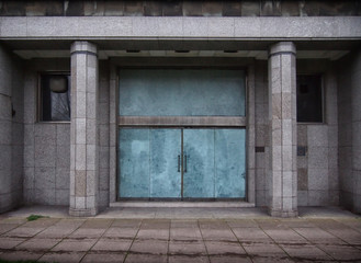 Fototapeta na wymiar closed doors in a old derelict office building
